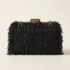 Back panel of Black fringe mini bag with strap attachments