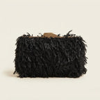 Black fringe mini bag, three-quarter angle showing side depth