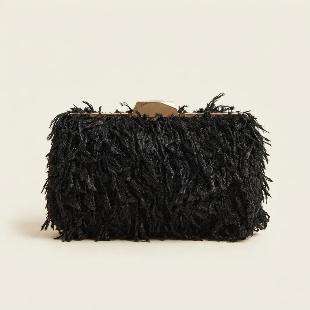 Black fringe mini bag, three-quarter angle showing side depth