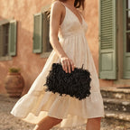 Woman wearing Black fringe mini bag with swaying fringe