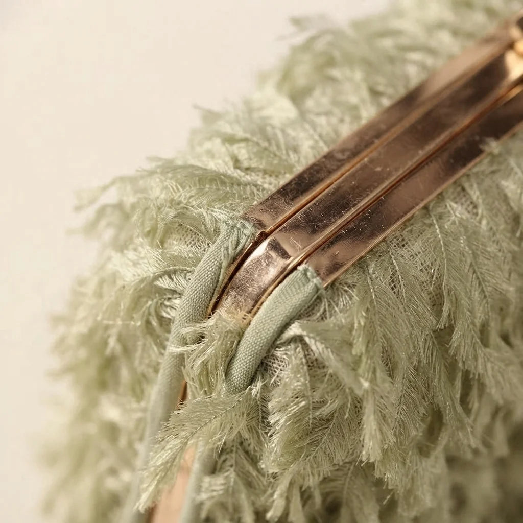 Close-up of fringe stitching and texture on Green fringe mini bag