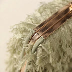 Close-up of fringe stitching and texture on Green fringe mini bag