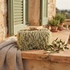 Green fringe mini bag styled in a warm Mediterranean setting