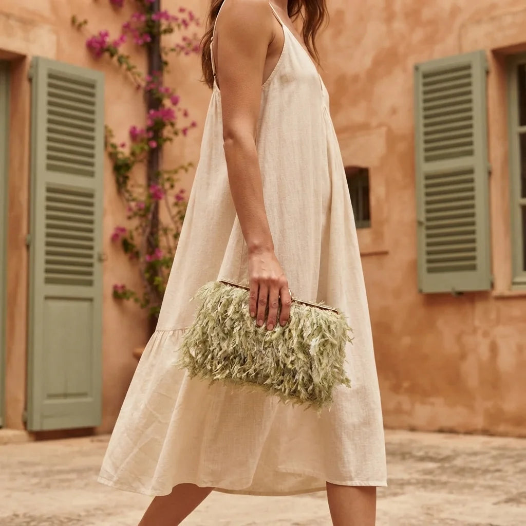 Woman wearing Green fringe mini bag with swaying fringe