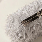 Close-up of fringe stitching and texture on Grey fringe mini bag
