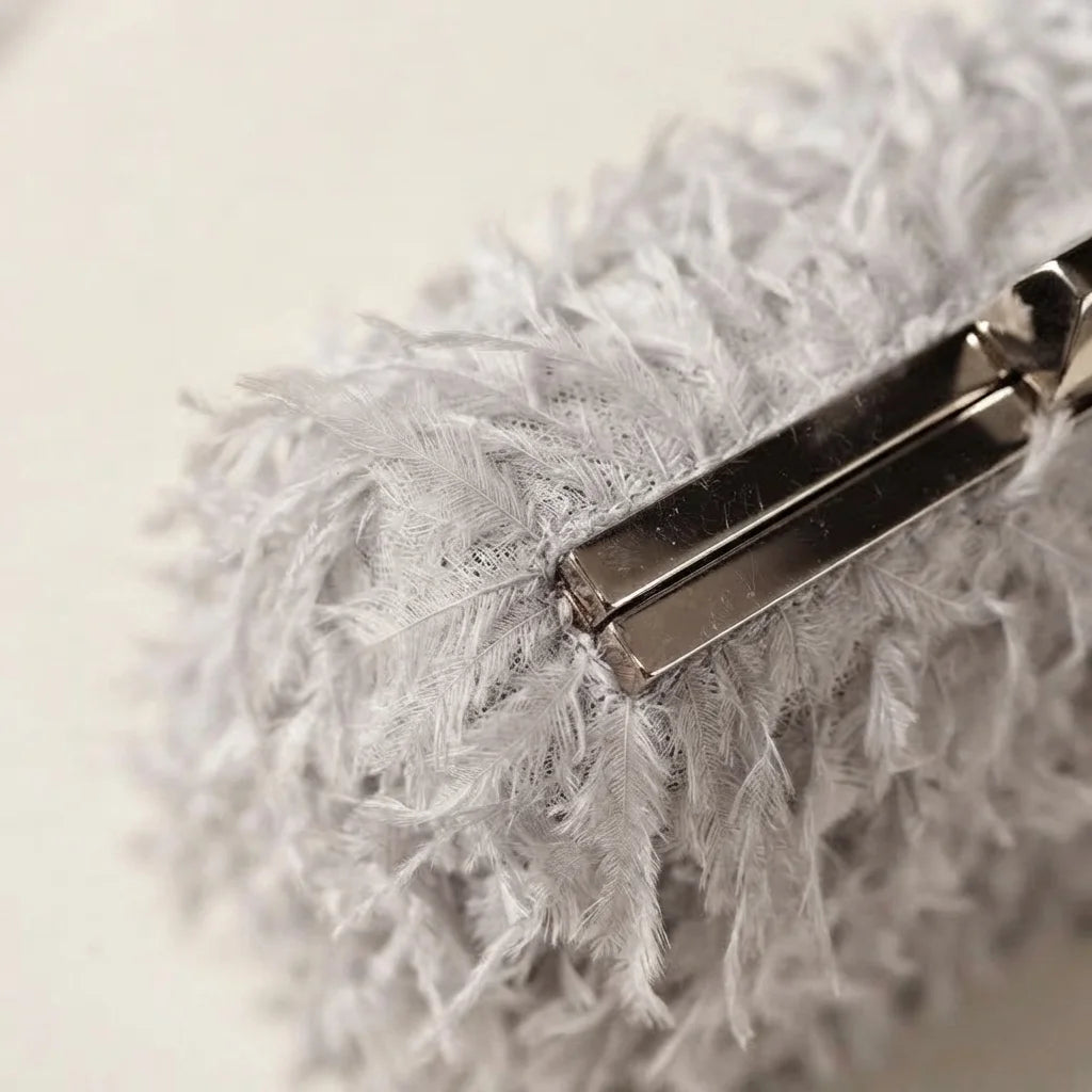 Close-up of fringe stitching and texture on Grey fringe mini bag