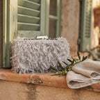 Grey fringe mini bag styled in a warm Mediterranean setting