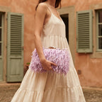 Woman wearing Lavender fringe mini bag with swaying fringe