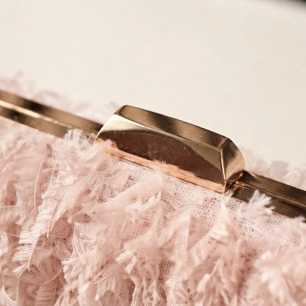 Close-up of fringe stitching and texture on Pink fringe mini bag