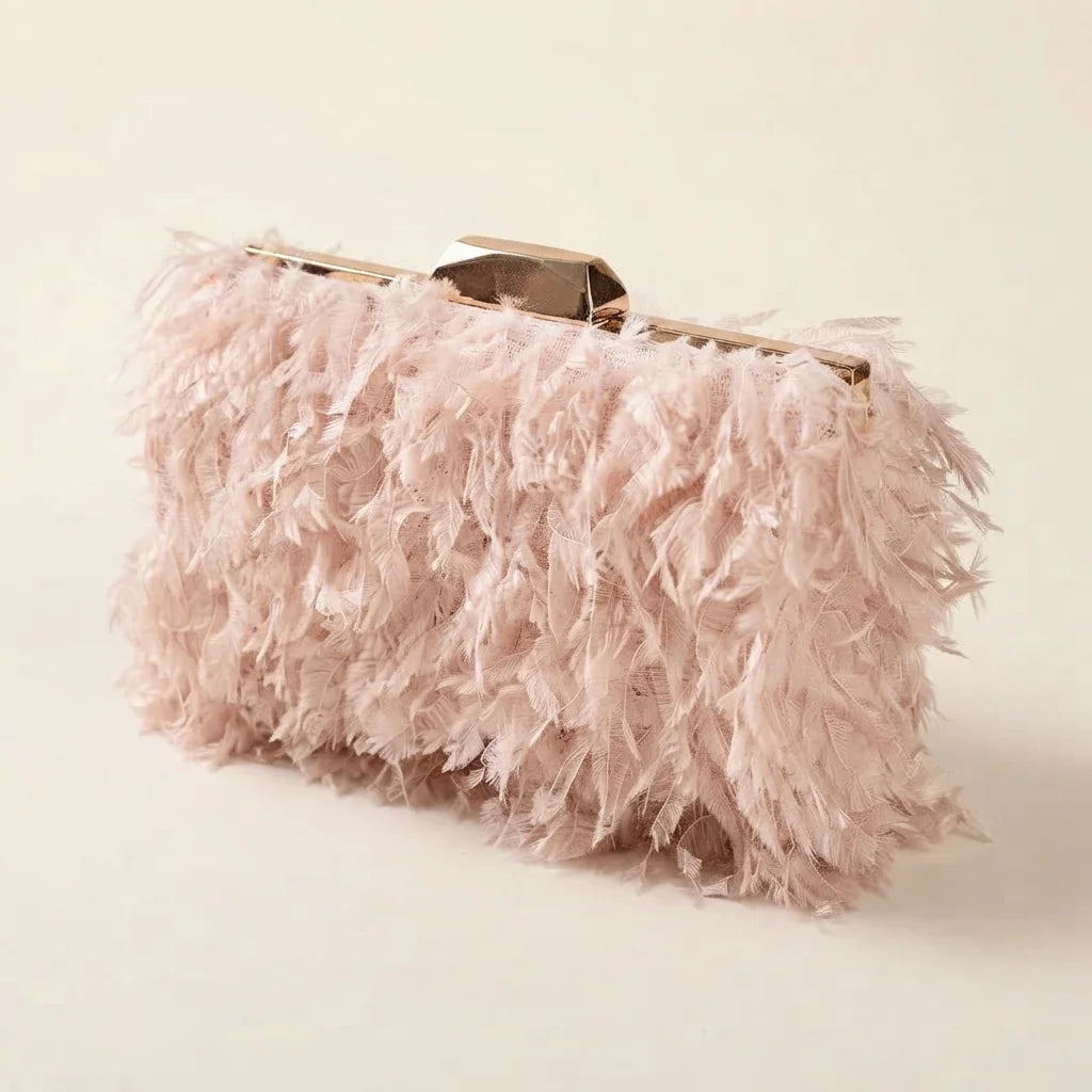 Pink fringe mini bag, three-quarter angle showing side depth