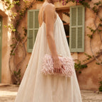 Woman wearing Pink fringe mini bag with swaying fringe