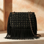 Back panel of Black fringe over shoulder bag with strap attachments