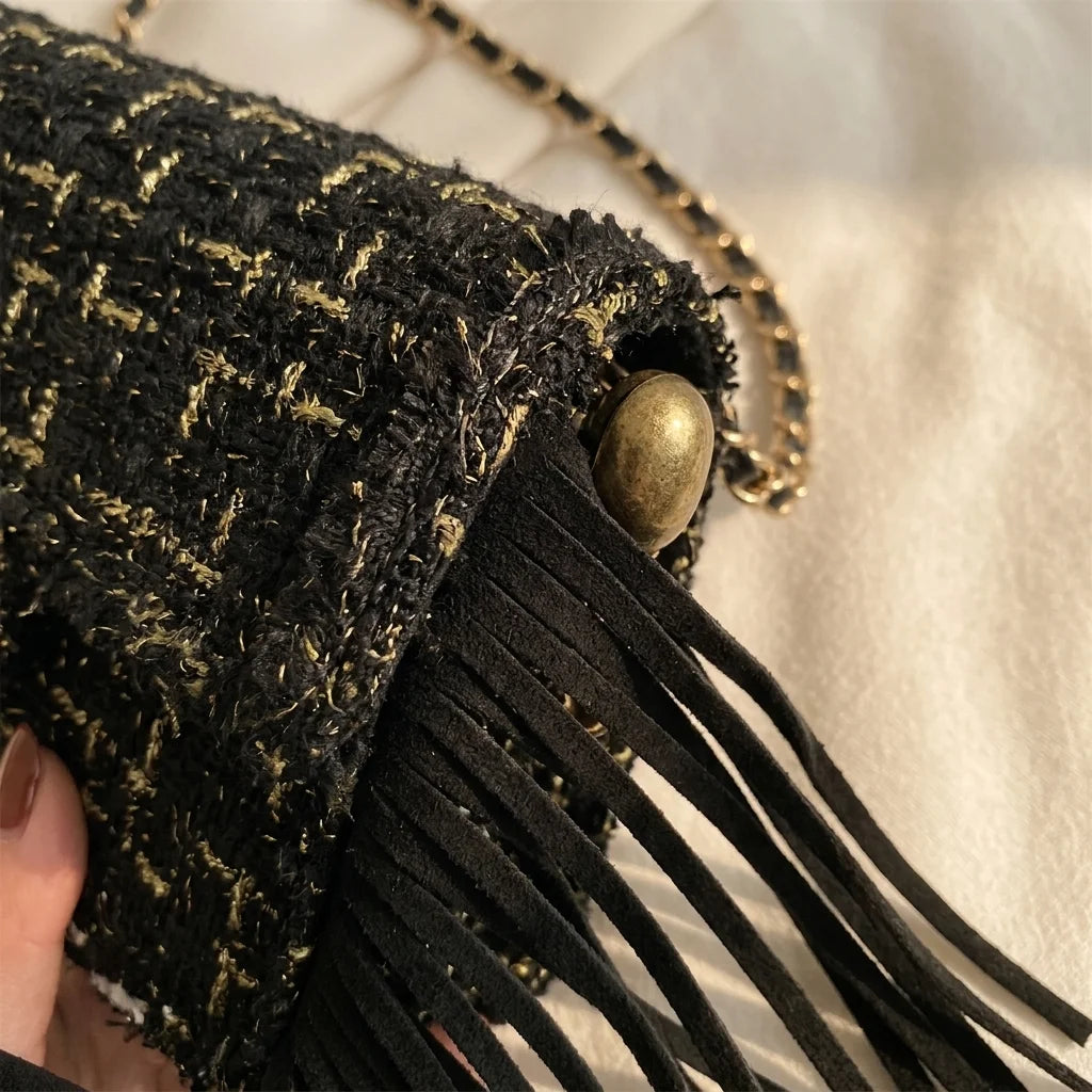 Close-up of fringe stitching and texture on Black fringe over shoulder bag
