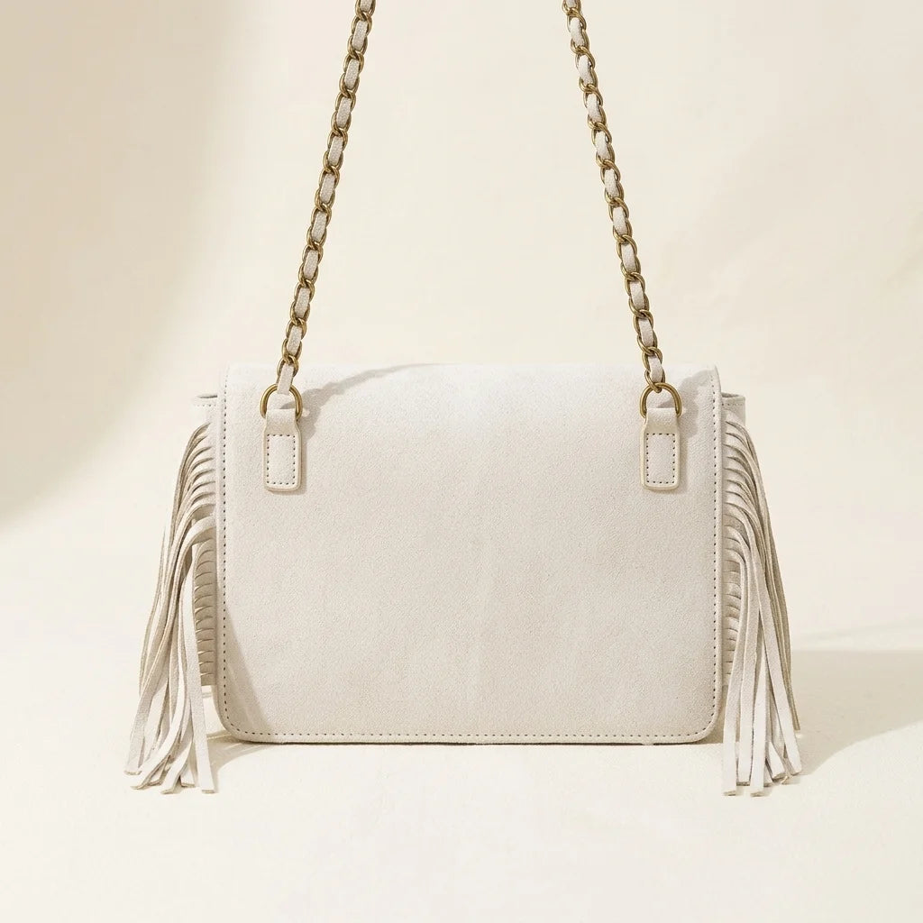 Back panel of White fringe over shoulder bag with strap attachments