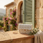 White fringe over shoulder bag styled in a warm Mediterranean setting