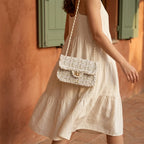 Woman wearing White fringe over shoulder bag with swaying fringe