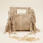 Close-up of fringe stitching and texture on Beige fringe satchel bag