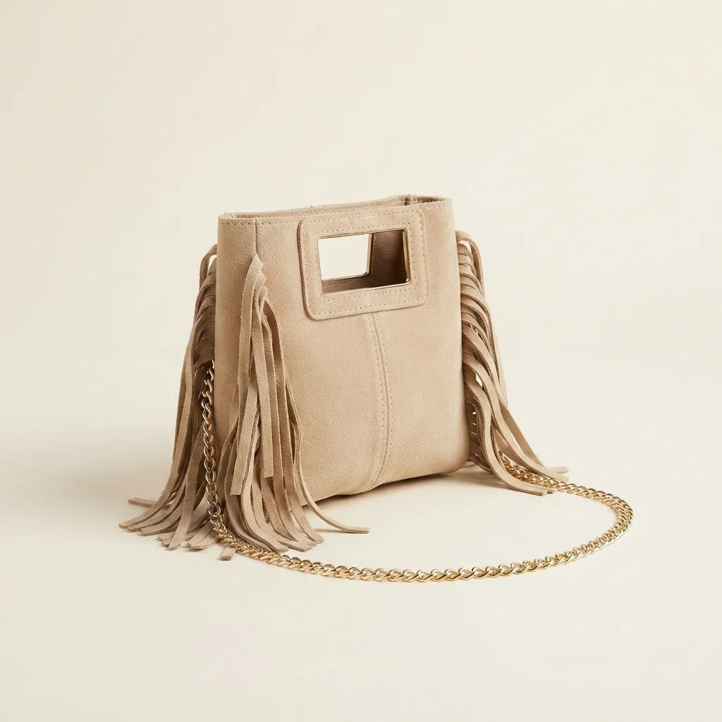 Beige fringe satchel bag, three-quarter angle showing side depth