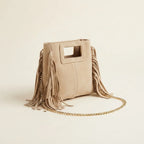 Beige fringe satchel bag, three-quarter angle showing side depth