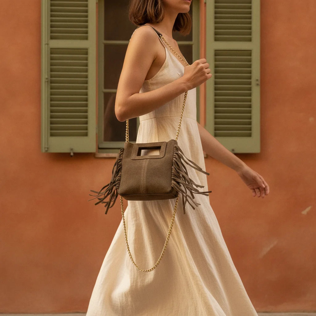 Woman wearing Beige fringe satchel bag with swaying fringe