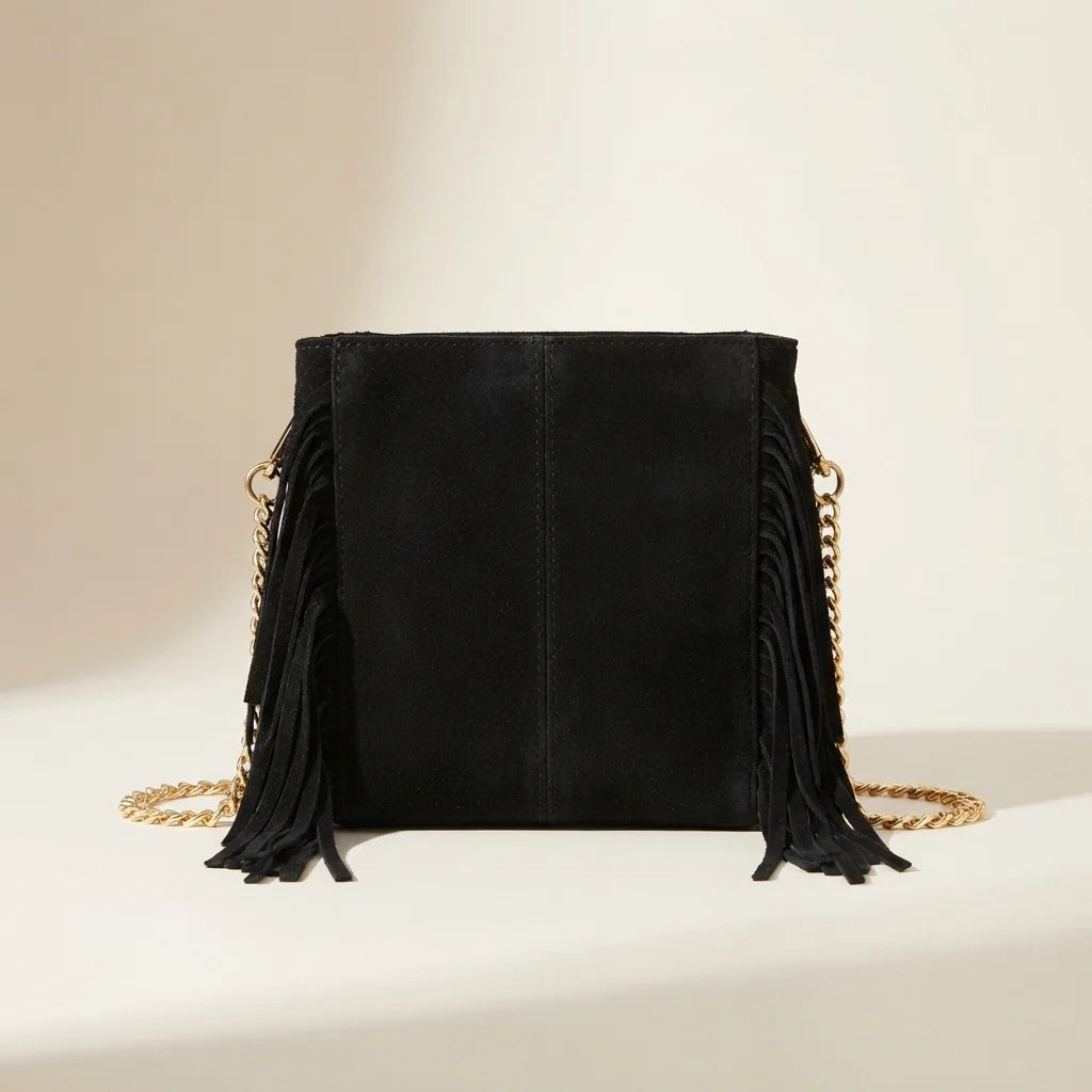 Back panel of Black fringe satchel bag with strap attachments