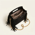 Interior lining and pockets of Black fringe satchel bag