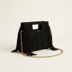 Black fringe satchel bag, three-quarter angle showing side depth