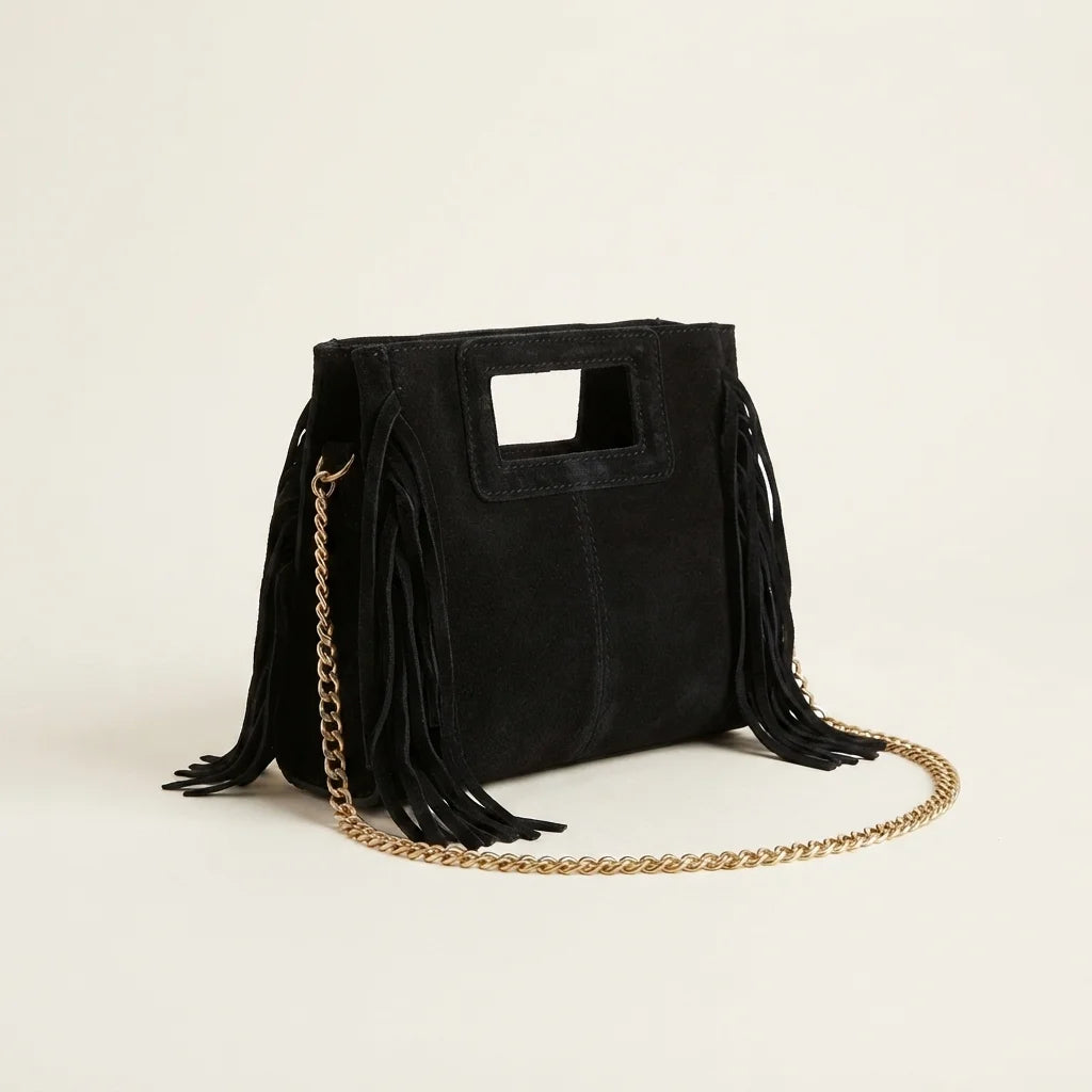 Black fringe satchel bag, three-quarter angle showing side depth