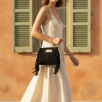 Woman wearing Black fringe satchel bag with swaying fringe