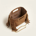 Interior lining and pockets of Camel fringe satchel bag