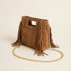 Camel fringe satchel bag, three-quarter angle showing side depth