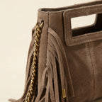 Close-up of fringe stitching and texture on Taupe fringe satchel bag