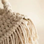 Close-up of fringe stitching and texture on Beige fringe shoulder bag with tassels
