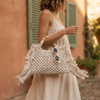 Woman wearing Beige fringe shoulder bag with tassels with swaying fringe