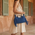 Woman wearing Blue fringe shoulder bag with tassels with swaying fringe