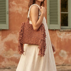 Woman wearing Brown fringe shoulder bag with tassels with swaying fringe