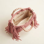 Interior lining and pockets of Pink fringe shoulder bag with tassels