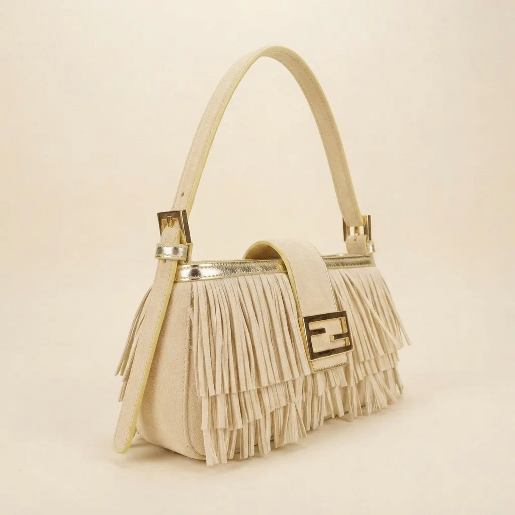 Cream fringe shoulder bags designer, three-quarter angle showing side depth