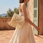 Woman wearing Cream fringe shoulder bags designer with swaying fringe