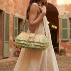 Woman wearing Green fringe shoulder bags designer with swaying fringe