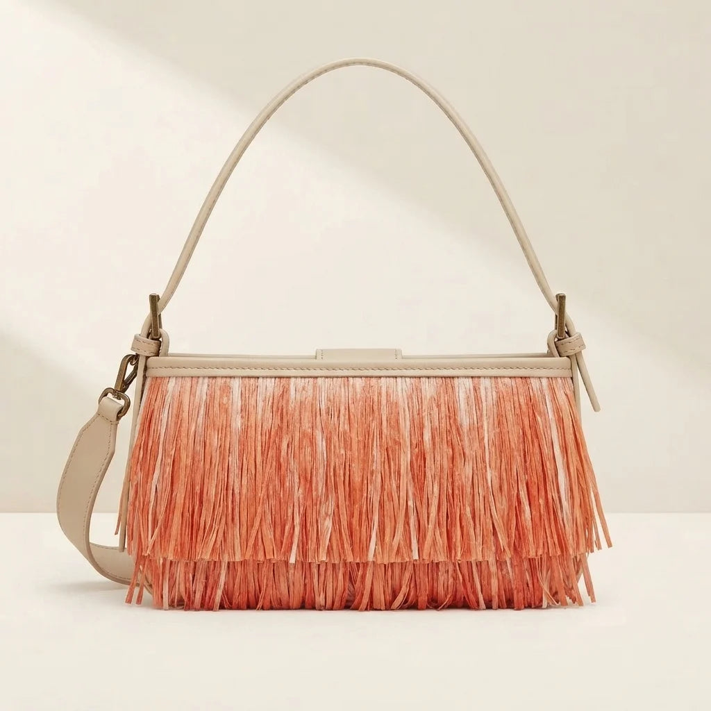 Back panel of Orange fringe shoulder bags designer with strap attachments