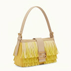 Yellow fringe shoulder bags designer, three-quarter angle showing side depth