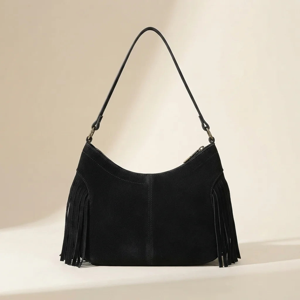 Back panel of Black fringe sling bag with strap attachments