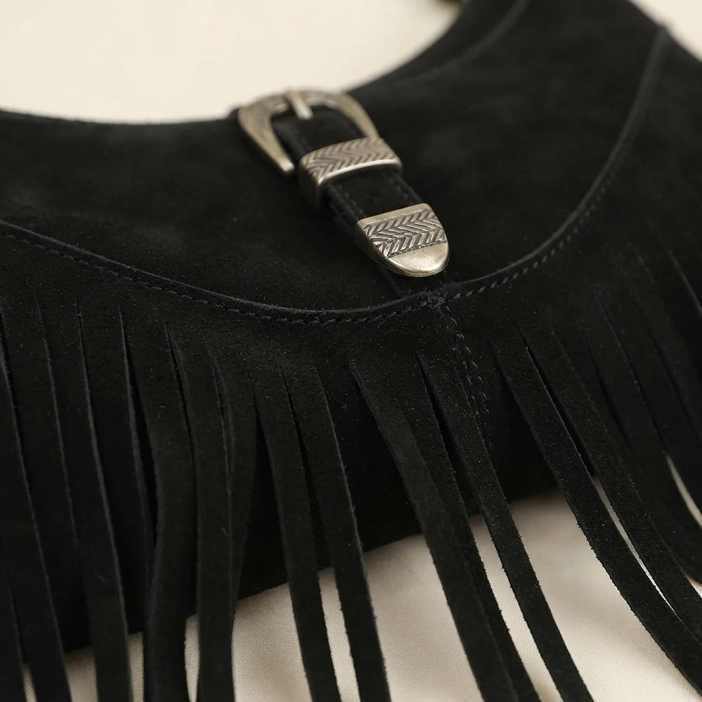 Close-up of fringe stitching and texture on Black fringe sling bag