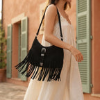 Woman wearing Black fringe sling bag with swaying fringe
