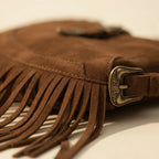 Close-up of fringe stitching and texture on Brown fringe sling bag