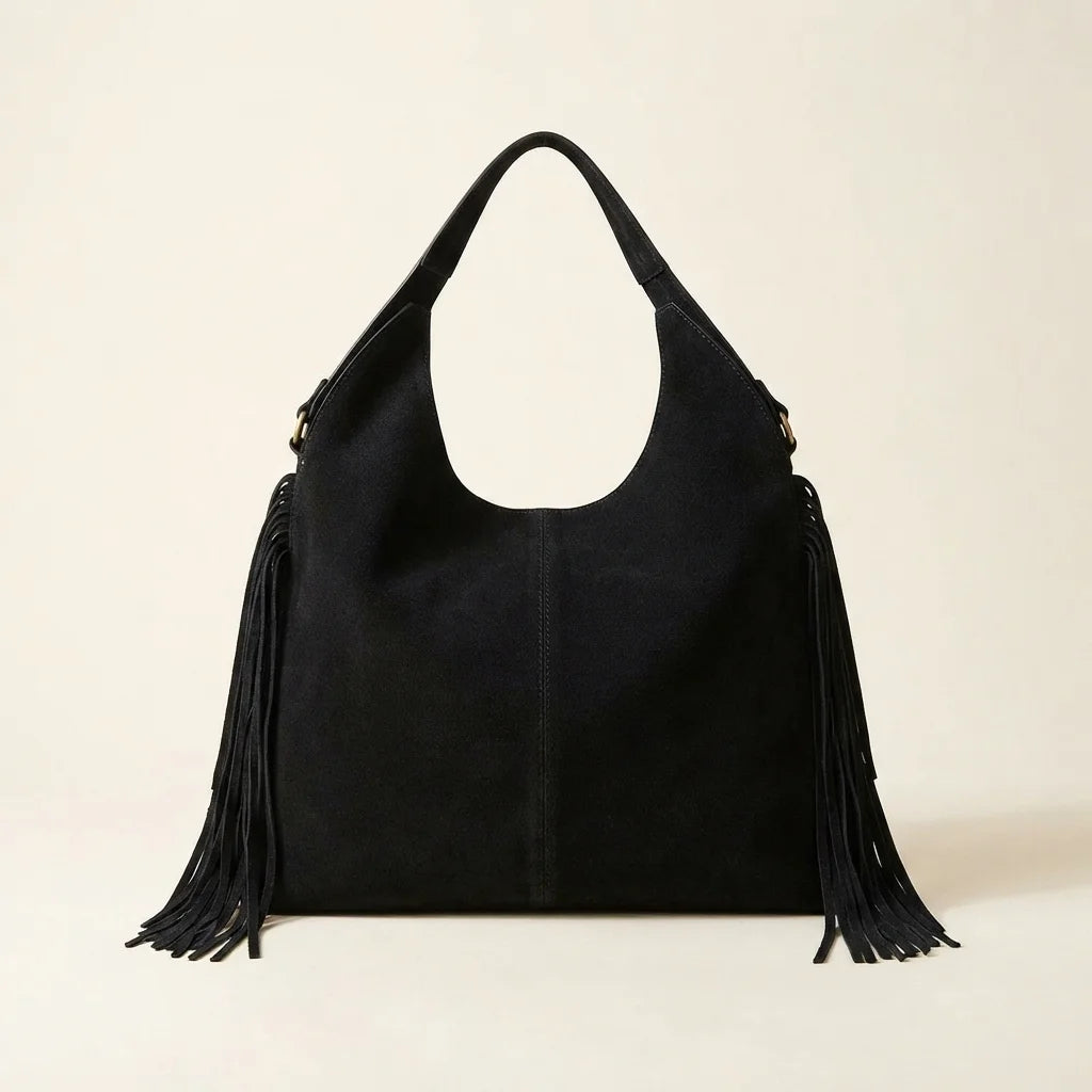 Back panel of Black fringe studded bag with strap attachments