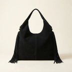 Back panel of Black fringe studded bag with strap attachments