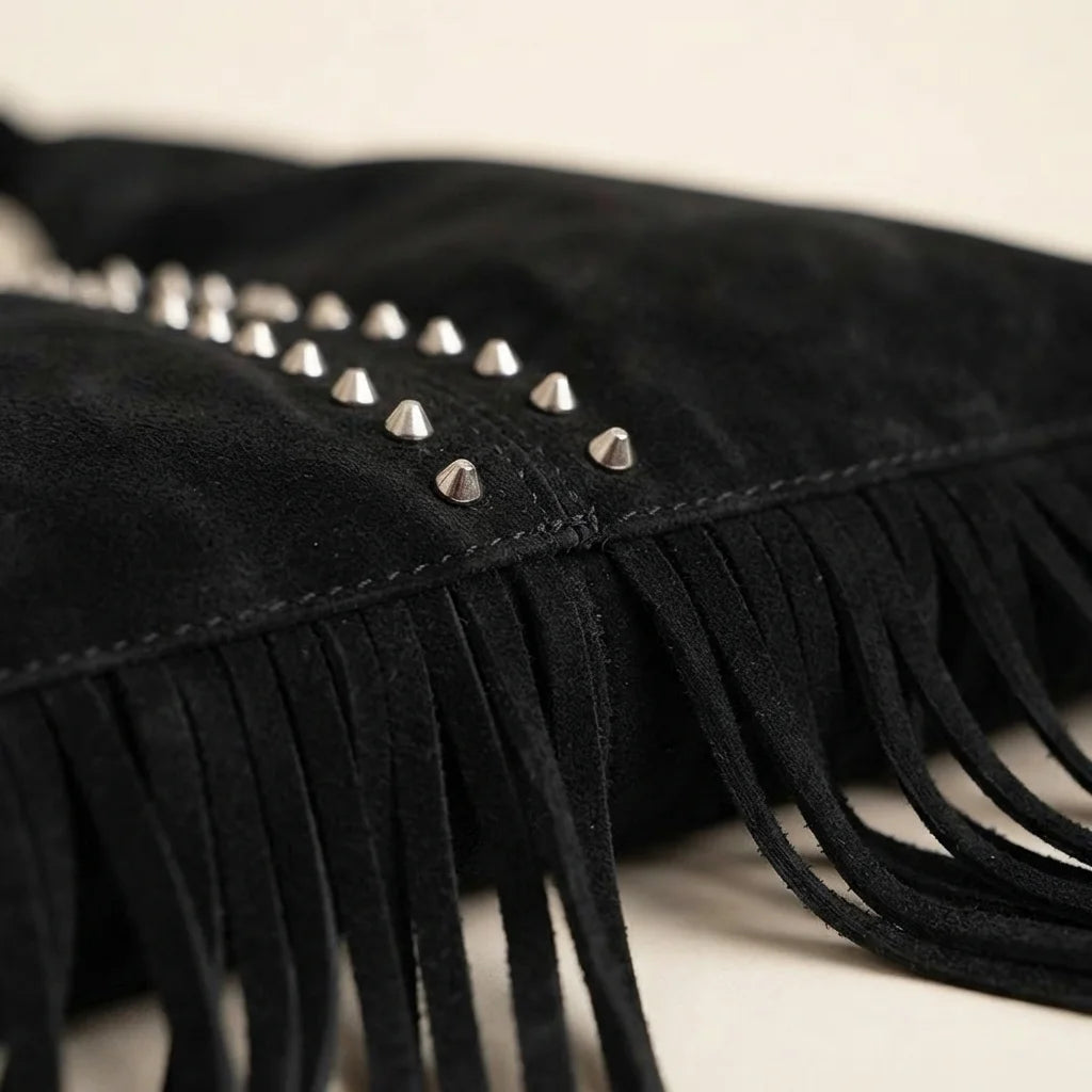 Close-up of fringe stitching and texture on Black fringe studded bag