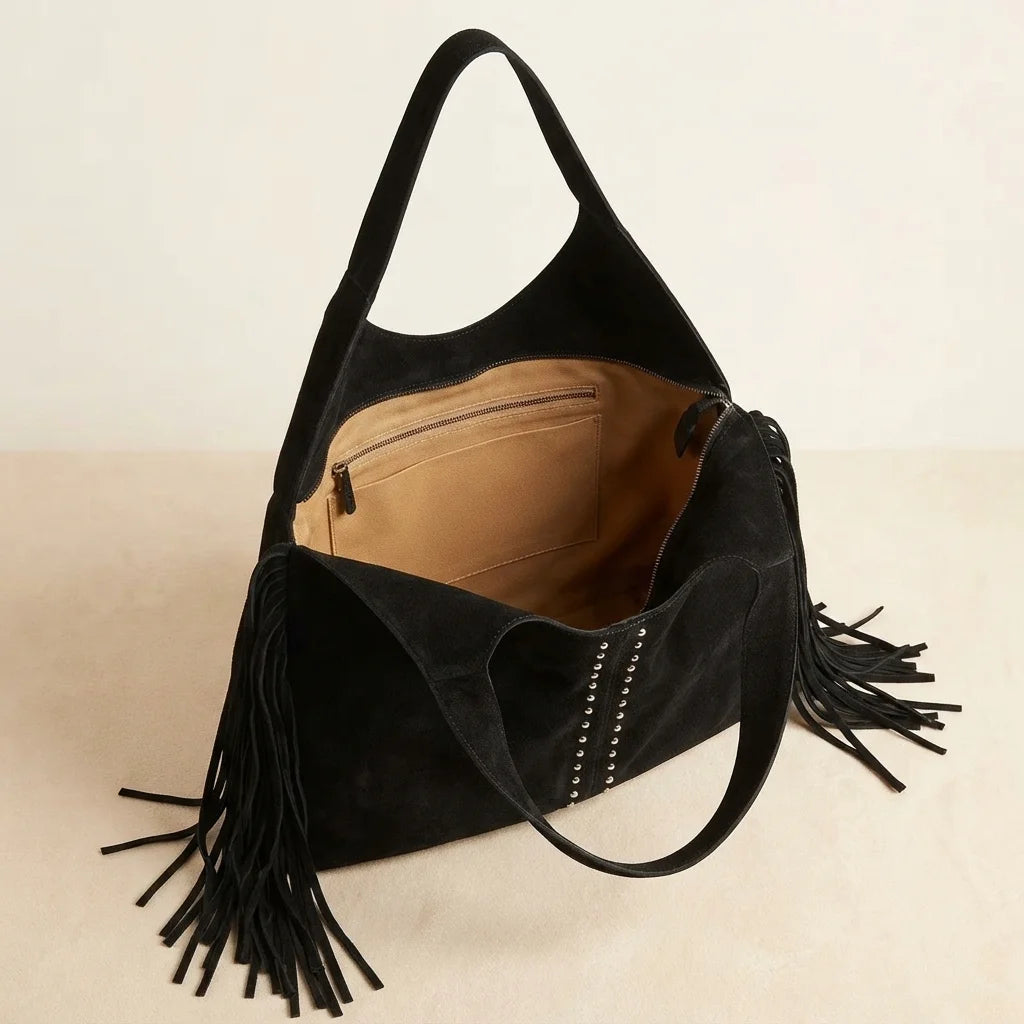 Interior lining and pockets of Black fringe studded bag